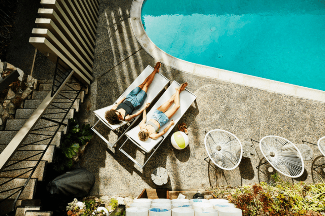 HomeExchange GuestPoints - couple by swimming pool